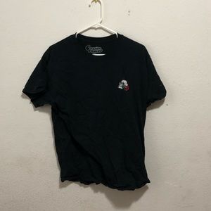 Tee shirt with skull holding a rose on the front